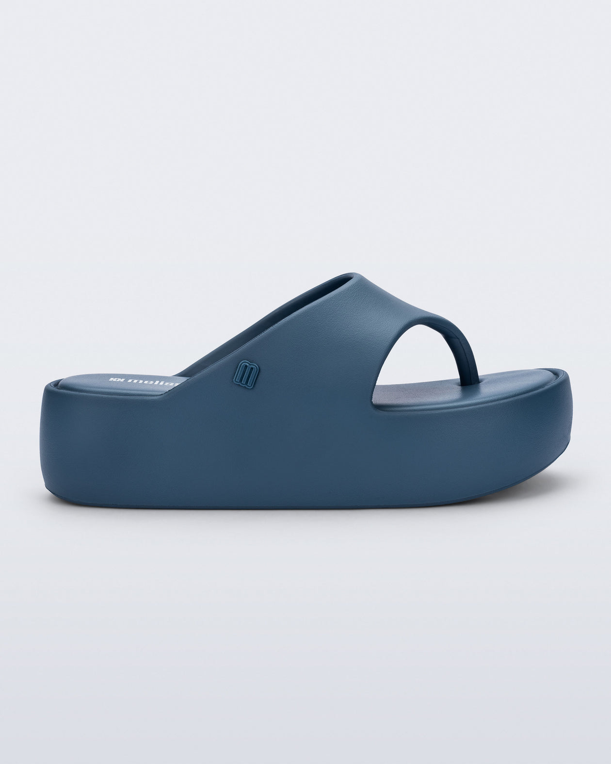 Side view of a blue Free Platform Thong sandal