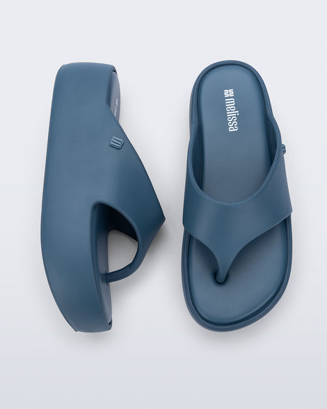 Side and top view of a pair of blue Free Platform Thong sandals
