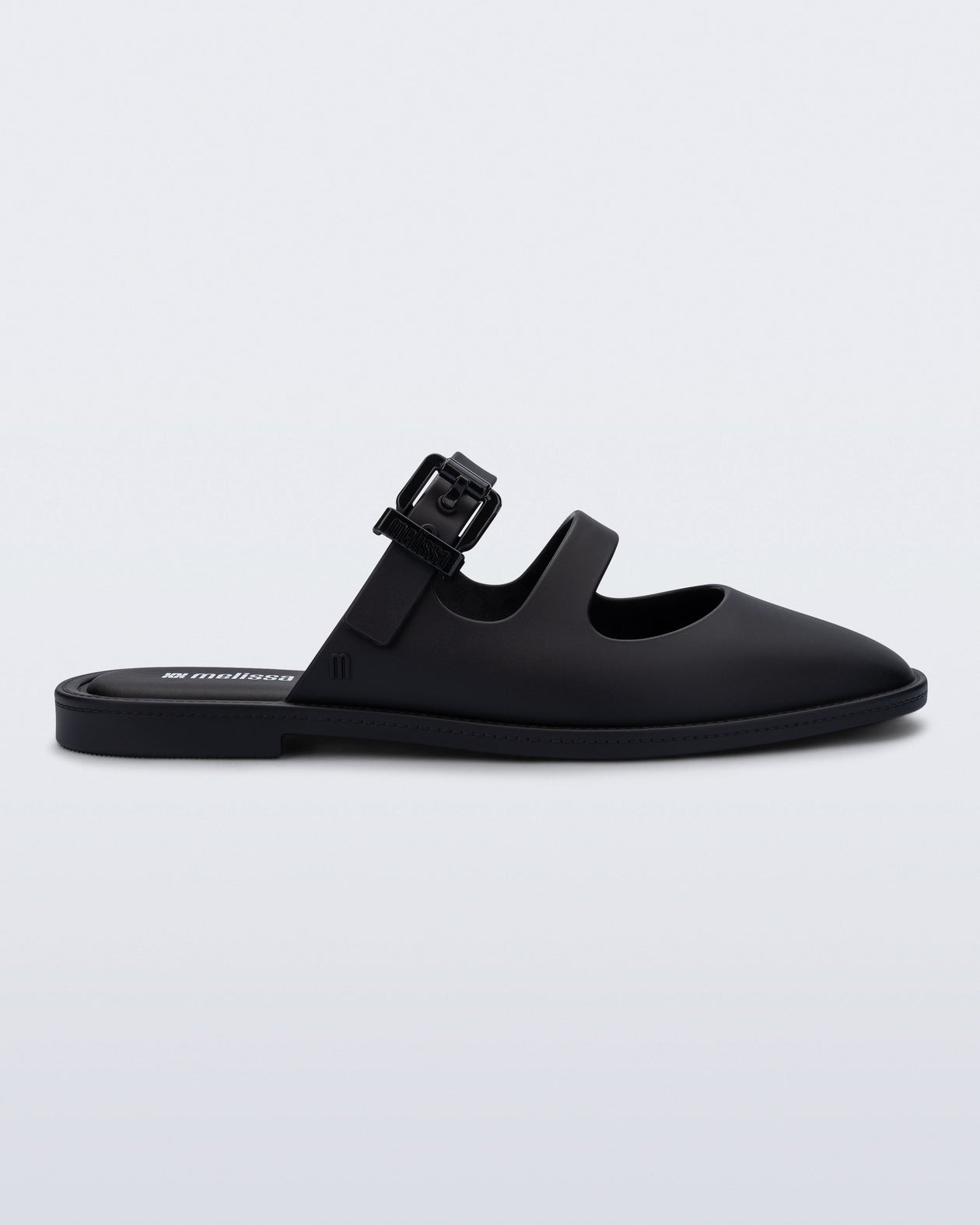 Side view of a matte black Anastasia slide mule