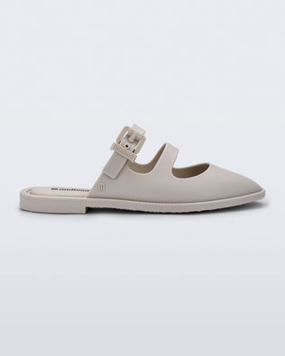 Side view of a matte beige Anastasia slide mule