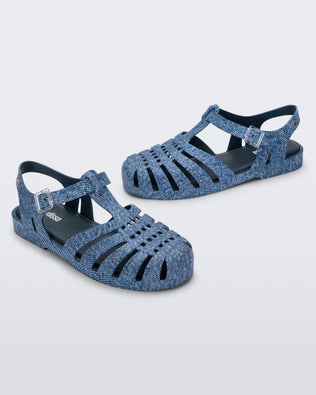 Angled view of a pair of blue jean Possession sandals.