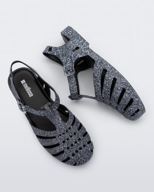 Top and side view of a pair of black jean Possession sandals.