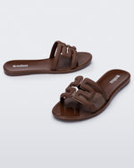 Angled view of a pair of brown M Slides.