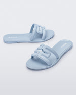 Angled view of a pair of light blue M Slides.