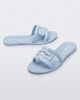Angled view of a pair of light blue M Slides.