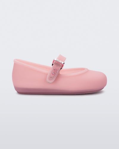 Side view of a milky pink Soft Ballerina baby flats