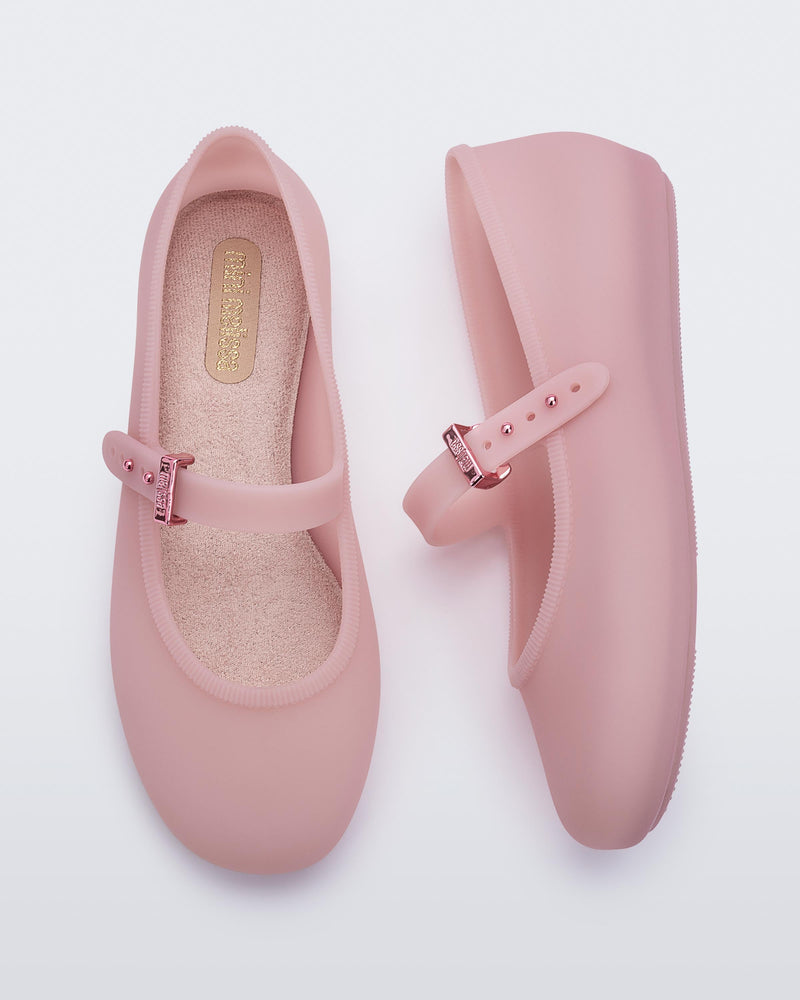 Top and side view of a pair of milky pink Soft Ballerina kids flats