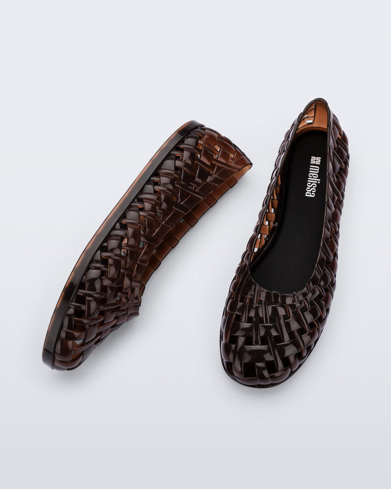 Side and top view of a pair of brown Possession Ballerina flats