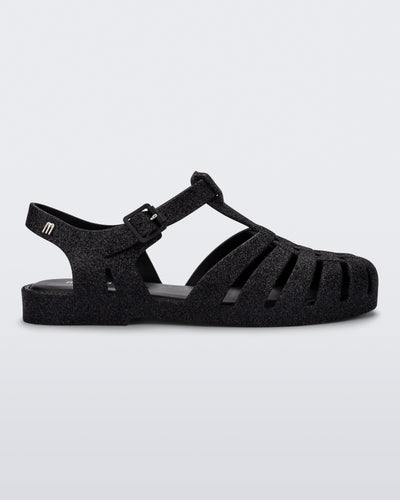 Side view of a glitter black Possession fisherman sandal