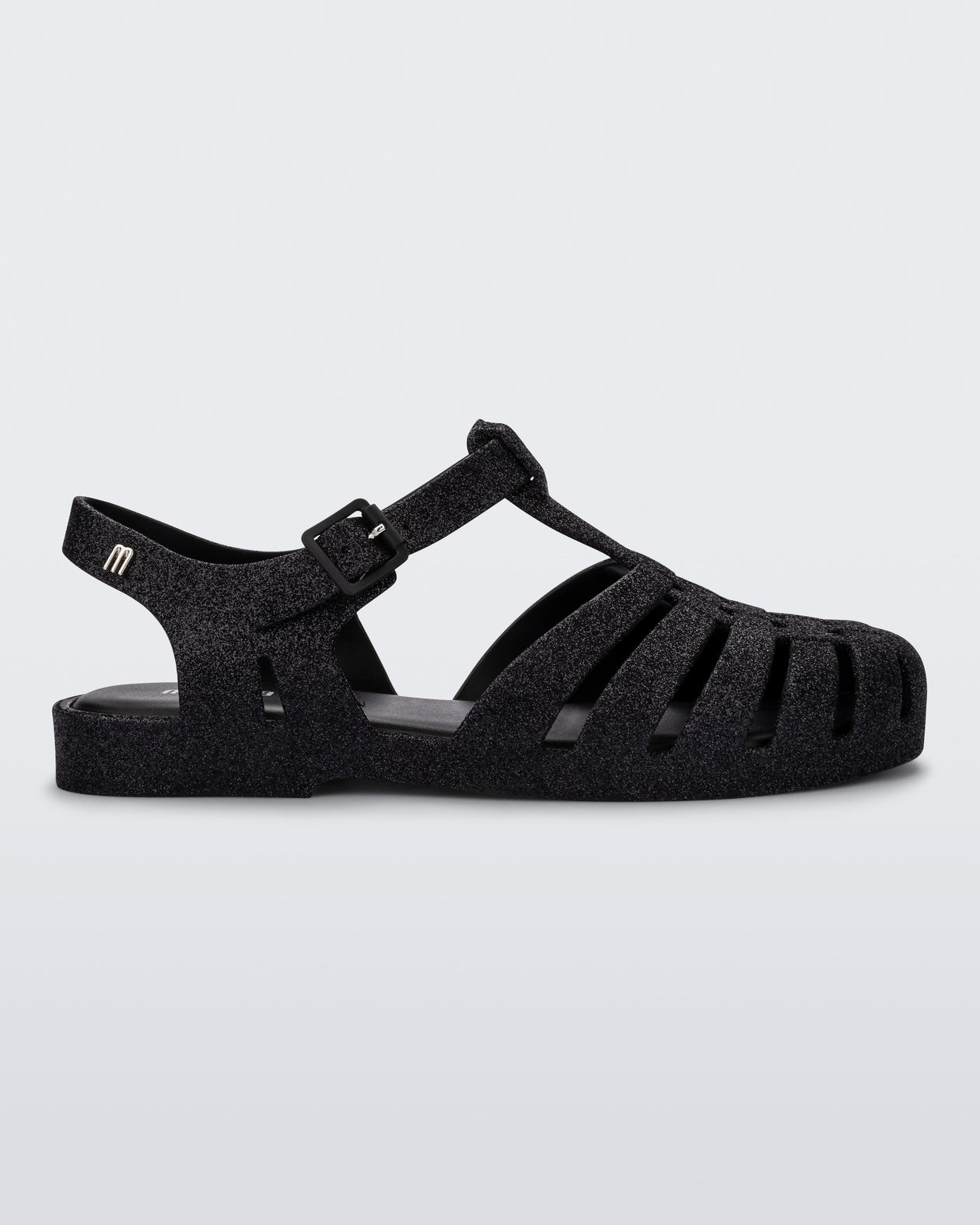 Side view of a glitter black Possession fisherman sandal