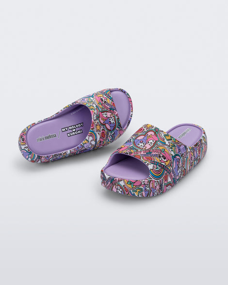 Top and angled view of a pair of lilac Free Platform slides + Hello Kitty and Friends kids sandals with Hello Kitty and Friends print