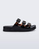 Side view of a black Cozy Stripe slide with tortoise colored straps