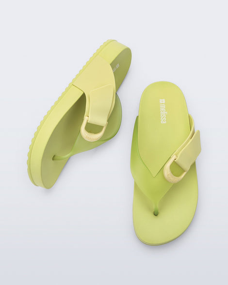 Top and side view of a pair of green Cozy Thong Flip Flops