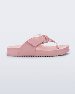 Side view of a pink Cozy Thong flip flop
