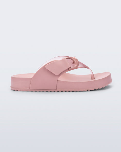 Side view of a pink Cozy Thong flip flop