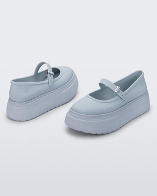 Side and angled view of a pair of light blue Soft Ballerina Platform flats.