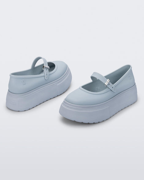 Side and angled view of a pair of light blue Soft Ballerina Platform flats.