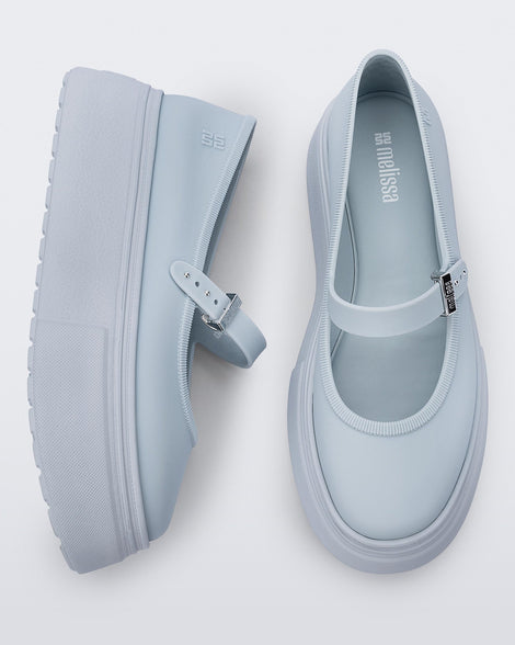 Side and top view of a pair of light blue Soft Ballerina Platform flats.