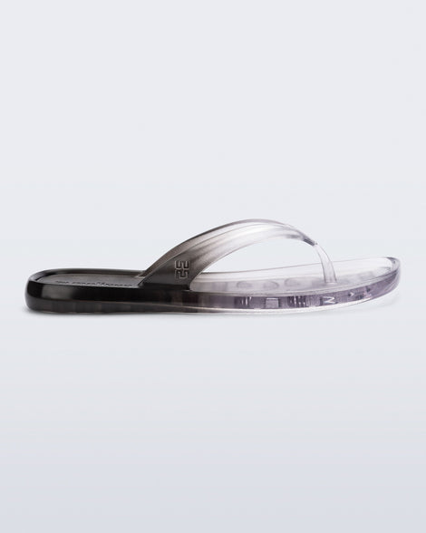 Side view of a black/clear Beachwear flip flop