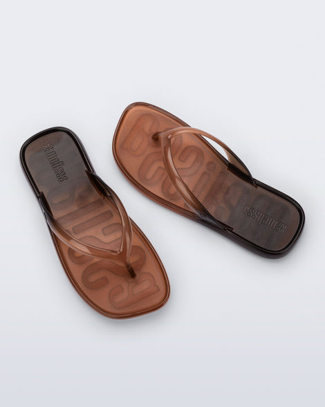 Top view of a pair of black/brown Beachwear flip flops