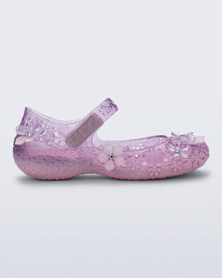 Side view of a pink Melissa + Susan Fang Luna Bloom flat with flower adornments