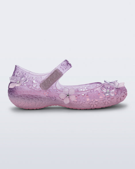 Side view of a pink Melissa + Susan Fang Luna Bloom flat with flower adornments