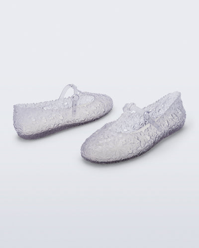 Back and side angled view of a pair of clear Melissa + Susan Fang Daphnis Ballerinas with t-top strap