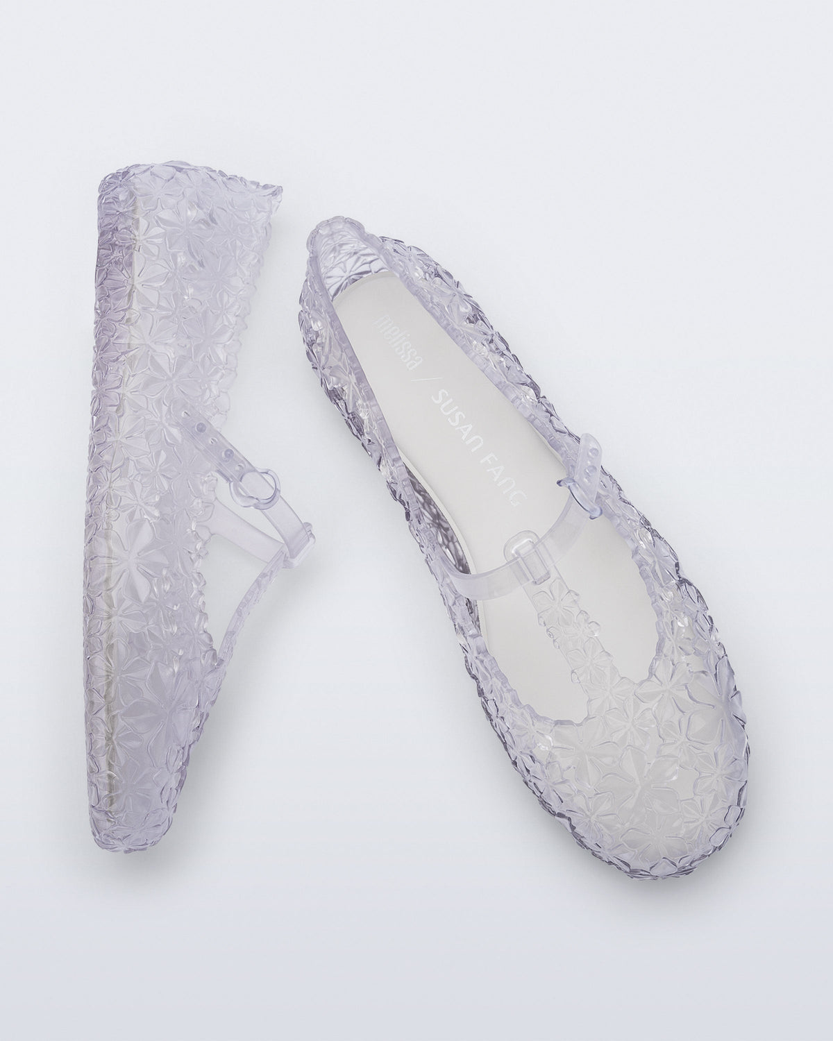 Top and side view of a pair of clear Melissa + Susan Fang Daphnis Ballerinas with t-top strap