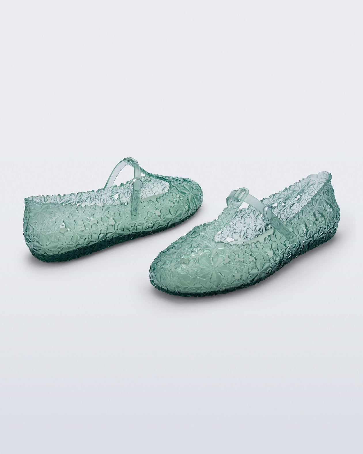 Back and side angled view of a pair of clear green Melissa + Susan Fang Daphnis Ballerinas with t-top strap