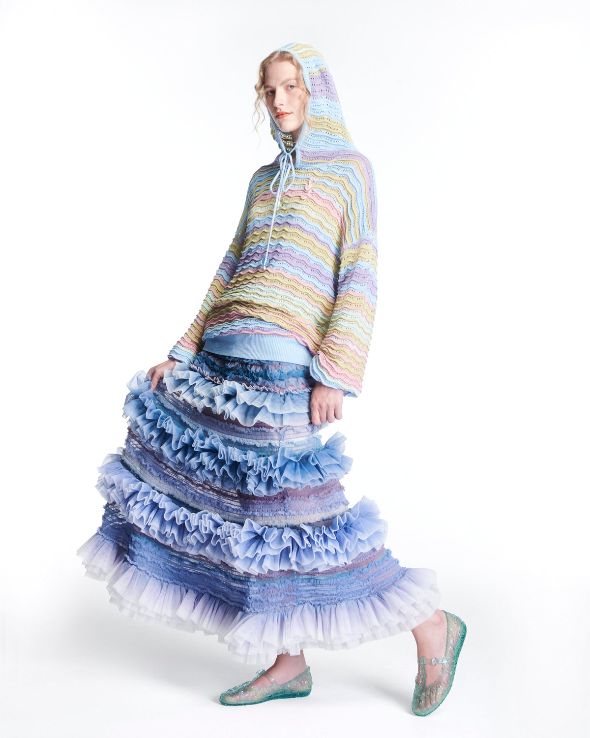 Model in a sweater and long skirt wearing a pair of clear green Melissa + Susan Fang Daphnis Ballerinas with t-top strap