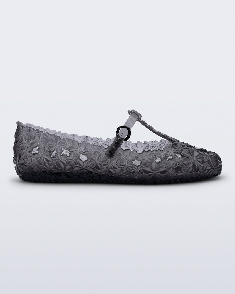 side view of a clear black Melissa + Susan Fang Daphnis Ballerinas with t-top strap