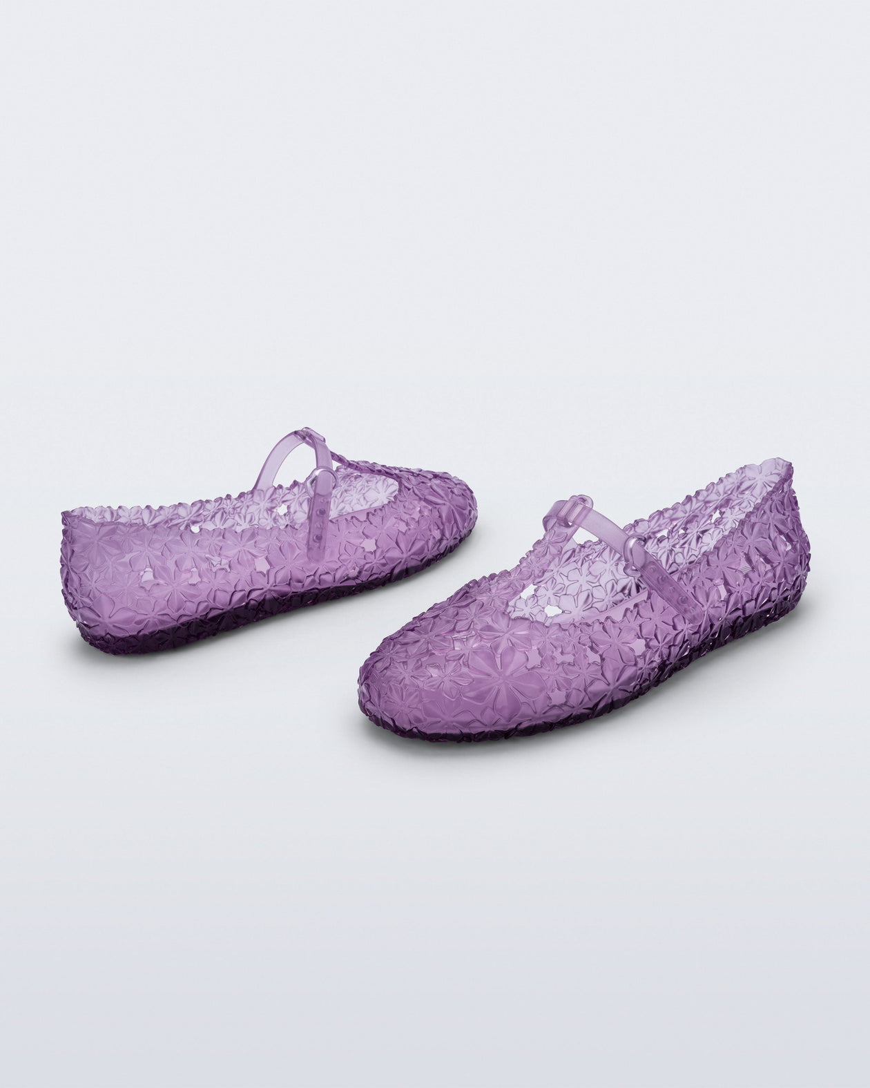 Back and side angled view of a pair of clear lilac Melissa + Susan Fang Daphnis Ballerinas with t-top strap