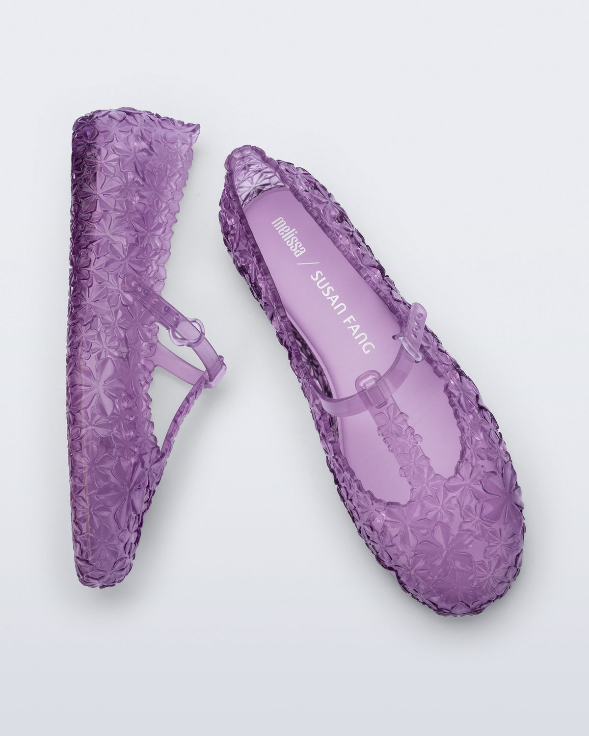 Top and side view of a pair of clear lilac Melissa + Susan Fang Daphnis Ballerinas with t-top strap