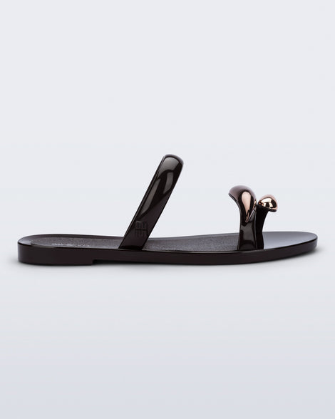 Side view of a brown Eden sandal with metallic upper accents
