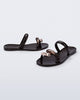 Side and angled view of a pair of brown Eden sandals with metallic upper accents
