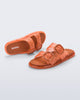 Top and side view of a pair of orange Possession Slip sandals with two straps with buckles