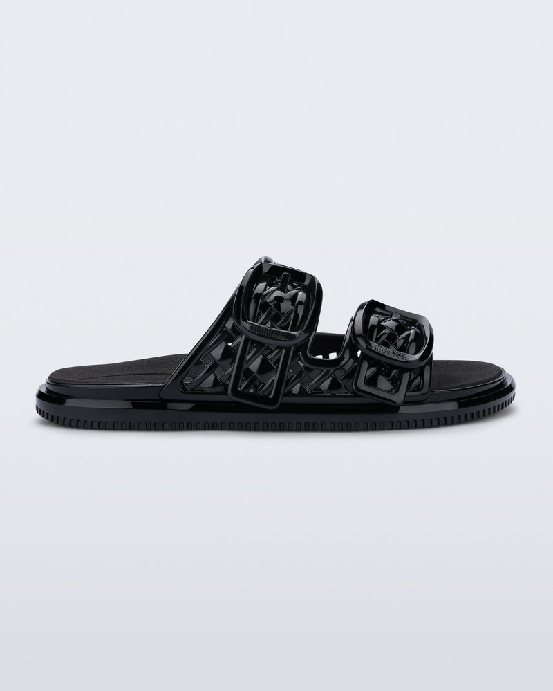 side view of a black Possession Slip sandals with two straps with buckles