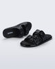 Top and side view of a pair of black Possession Slip sandals with two straps with buckles