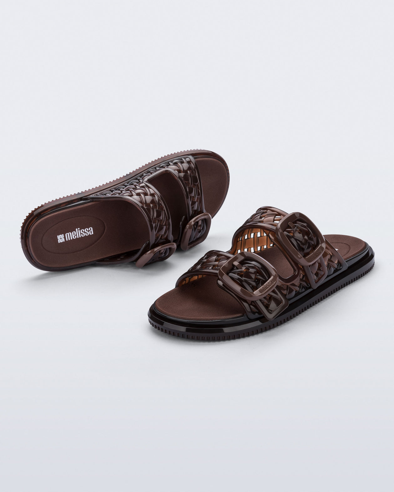 Top and side view of a pair of brown Possession Slip sandals with two straps with buckles