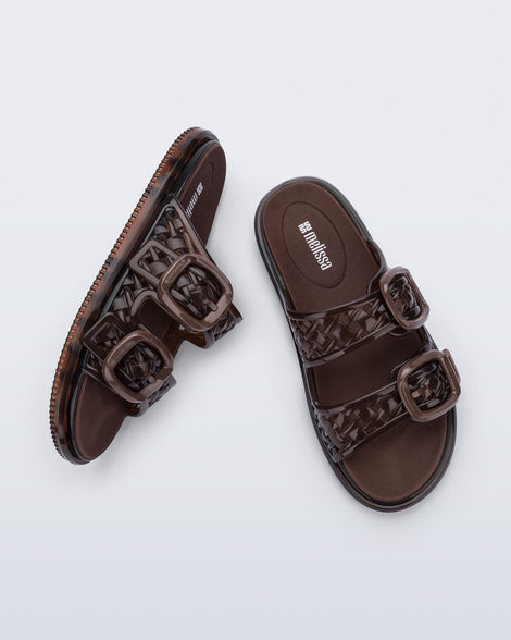 Top and side view of a pair of brown Possession Slip sandals with two straps with buckles