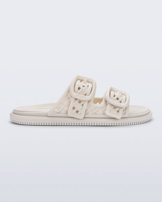 side view of a beige Possession Slip sandal with two straps with buckles