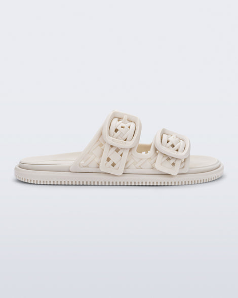 side view of a beige Possession Slip sandal with two straps with buckles