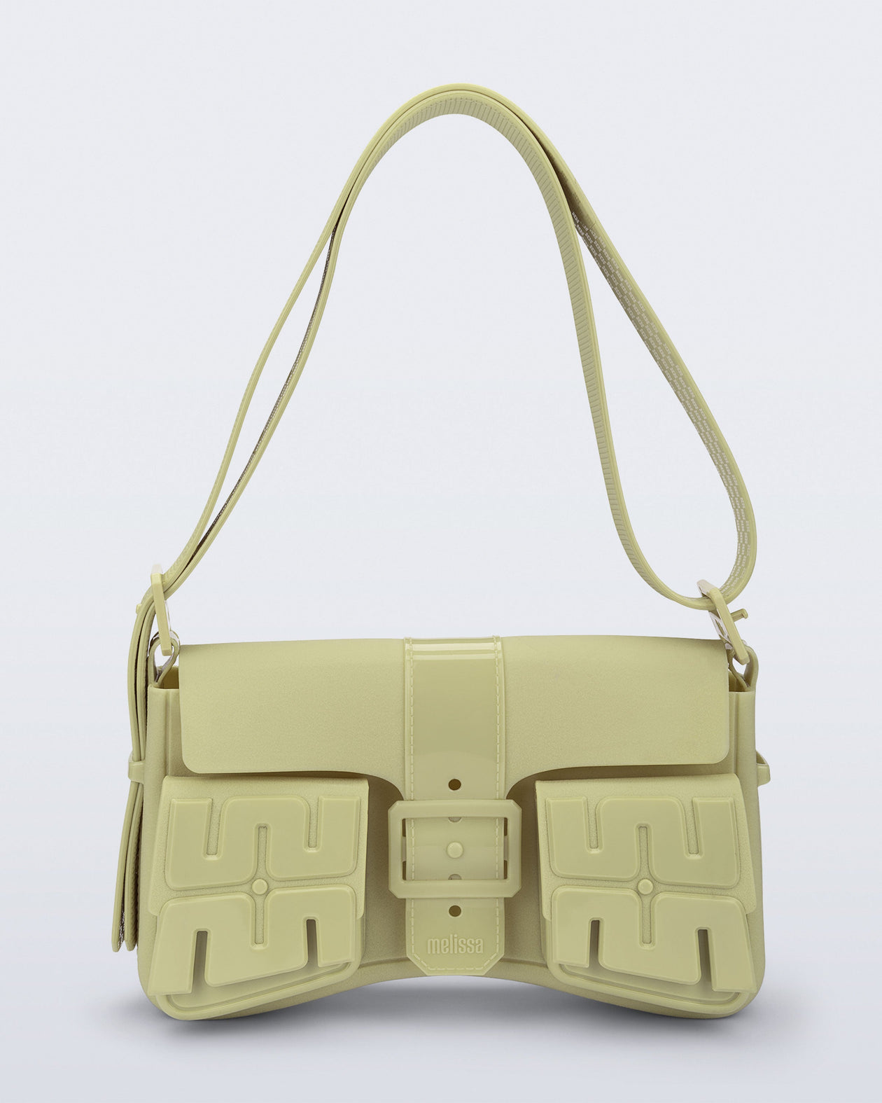 Front view of a pastel green Cargo bag with two small pockets on the front and an adjustable strap