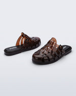 Side and back angled view of a pair of brown Possession Mule slides 
