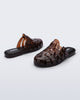 Side and back angled view of a pair of brown Possession Mule slides 