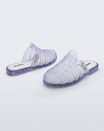 Side and back angled view of a pair of frosted clear Possession Mule slides 