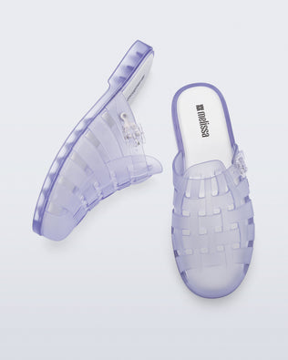 Side and top angled view of a pair of frosted clear Possession Mule slides 