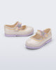 Side and angled view of a pair of beige Hip Ballerina Star baby Mary Jane shoes with lavender soles and star-shaped straps