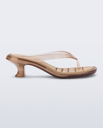 Side view of a clear beige Flip Flop Kitten Heels