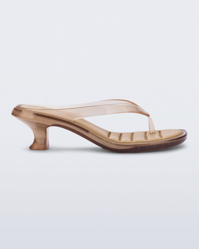 Side view of a clear beige Flip Flop Kitten Heels